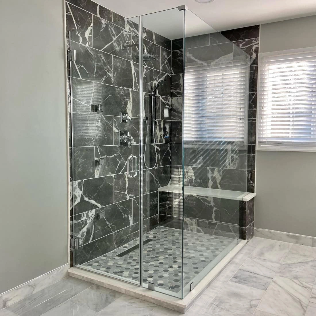 Black marble shower and grey Sherwin Williams Argos walls