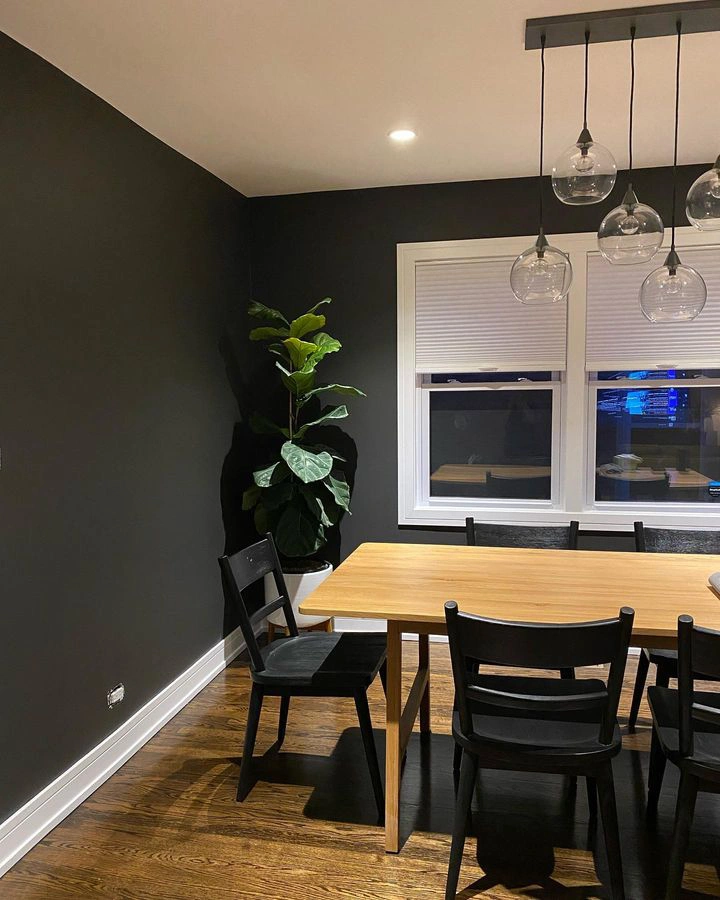 Black walls in a dining room Sherwin Williams Iron Ore 7069