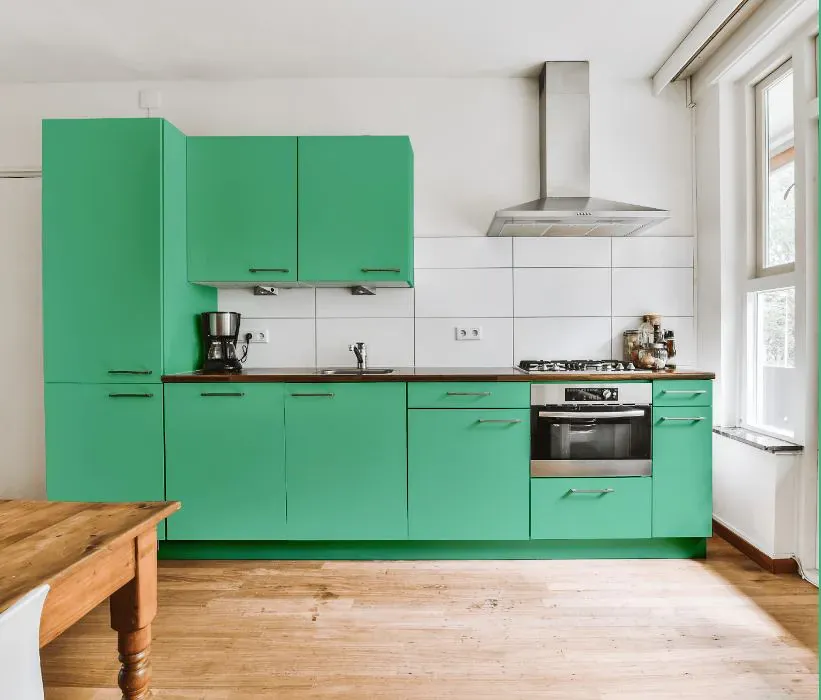 Sherwin Williams Active Green kitchen cabinets