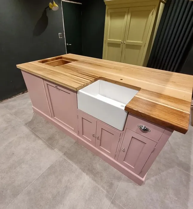Hellebore pink kitchen island with board oak worktop