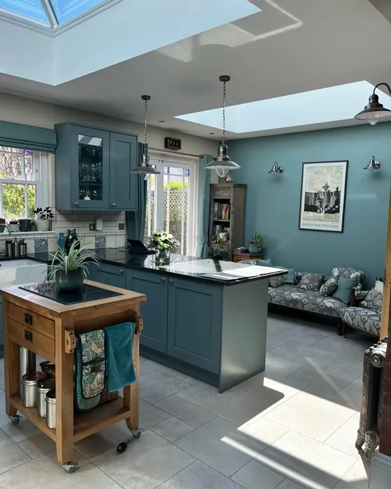 Oval Room Blue dusted blue kitchen cabinets and accent wall