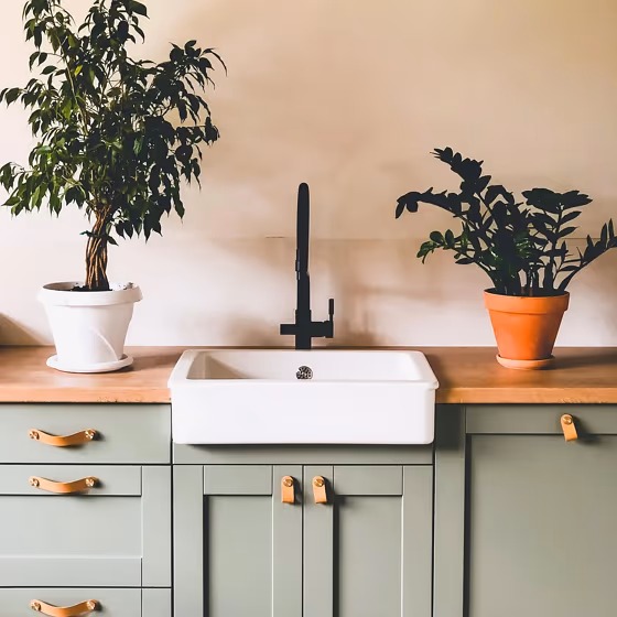 RAL Classic Cement grey RAL 7033 beautiful kitchen cabinet with fresh plants