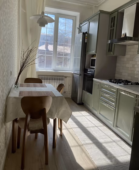 RAL Classic Cement grey RAL 7033 kitchen cabinet on a sunny day