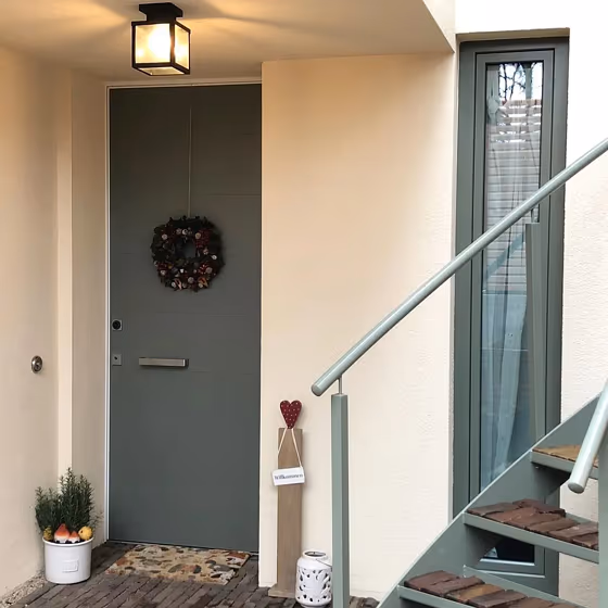 RAL Classic Cement grey RAL 7033 house exterior with stairs