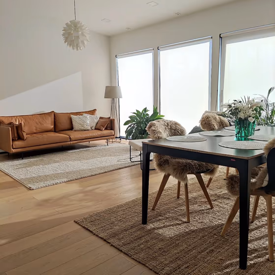 Tikkurila Paper F497 house interior with orange sofa