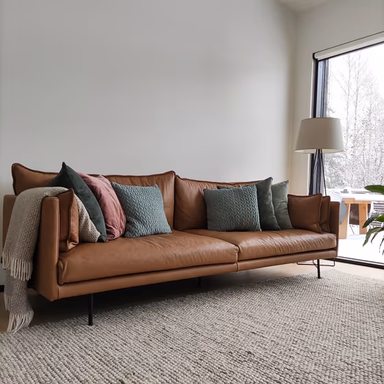 Tikkurila Paper F497 living room with lether orange sofa