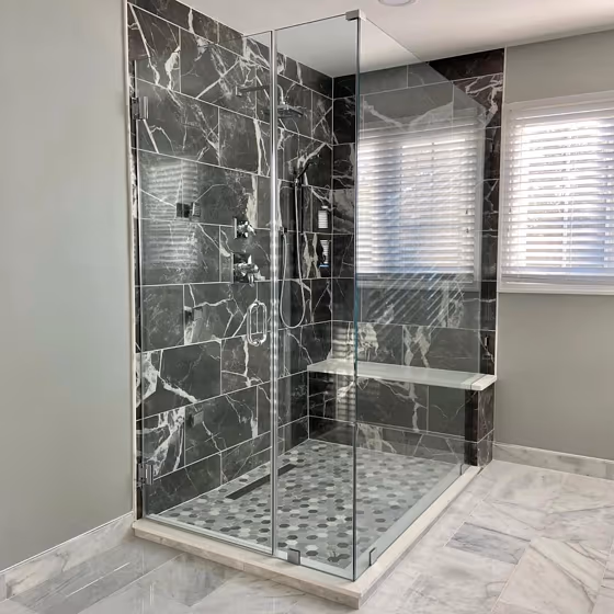 Black marble shower and grey Sherwin Williams Argos walls