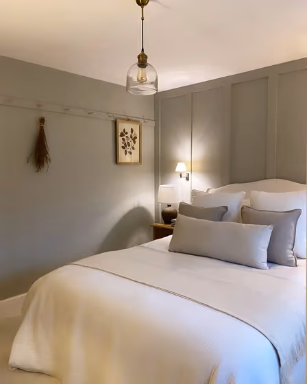 Grey bedroom panelling Dulux Stone Green color