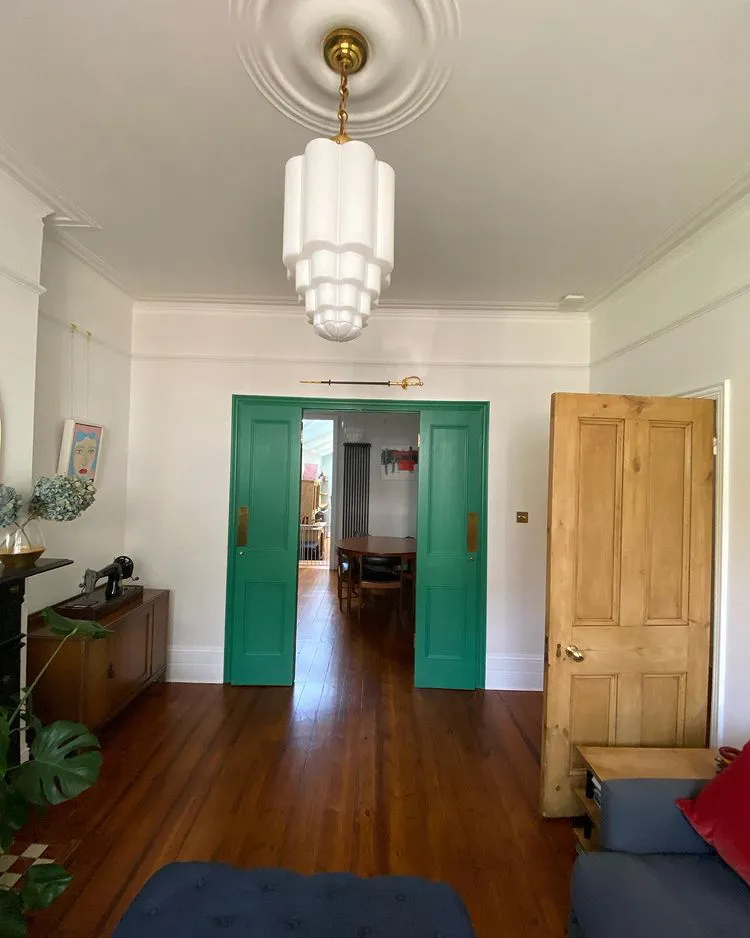 Interior with white walls Flint and green vintage door
