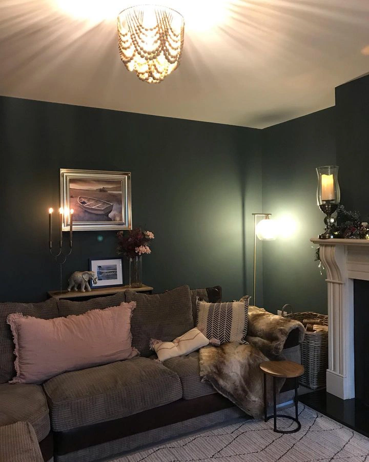 Living room painted Farrow and Ball Inchyra Blue at night