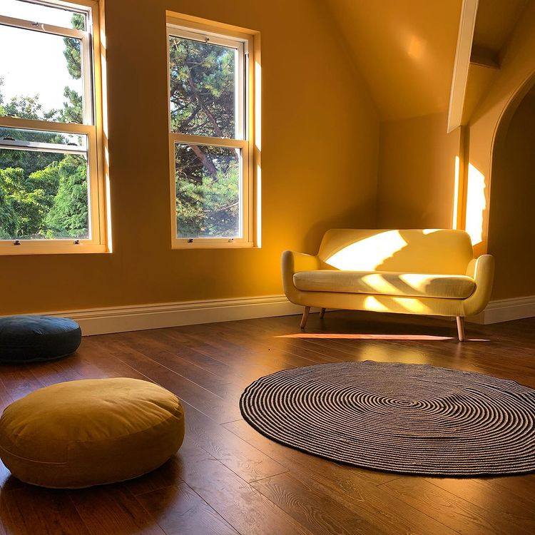 Shiny yellow living room idea with Farrow and Ball