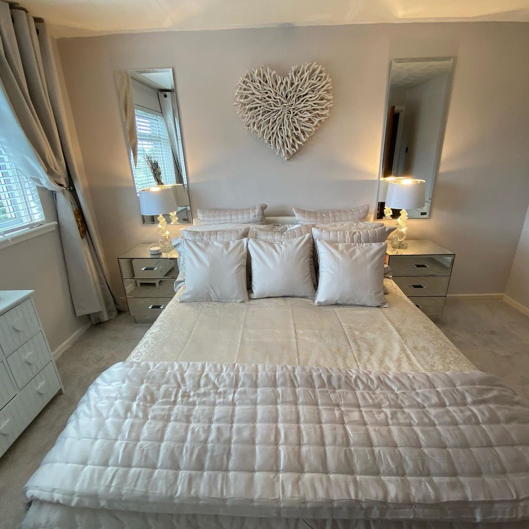 Wooden heart decoratin in beige bedroom