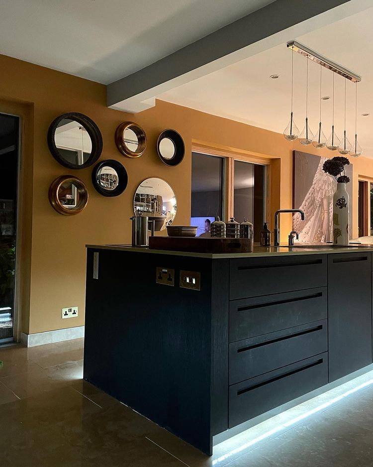 Black kitchen cabinets with Farrow and Ball India Yellow finish