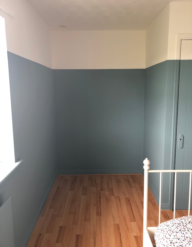 Half-painted walls with blue Tikkurila L491 and white