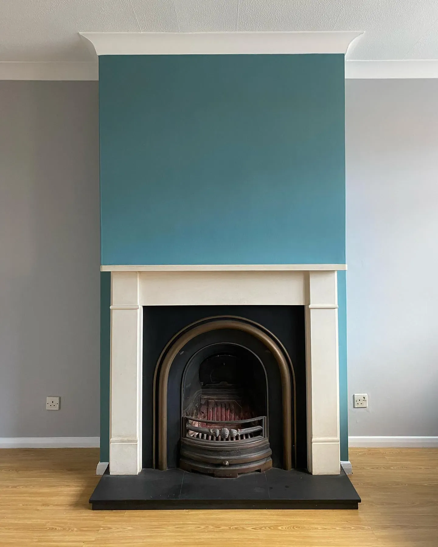 Dulux Maritime Teal living room fireplace 