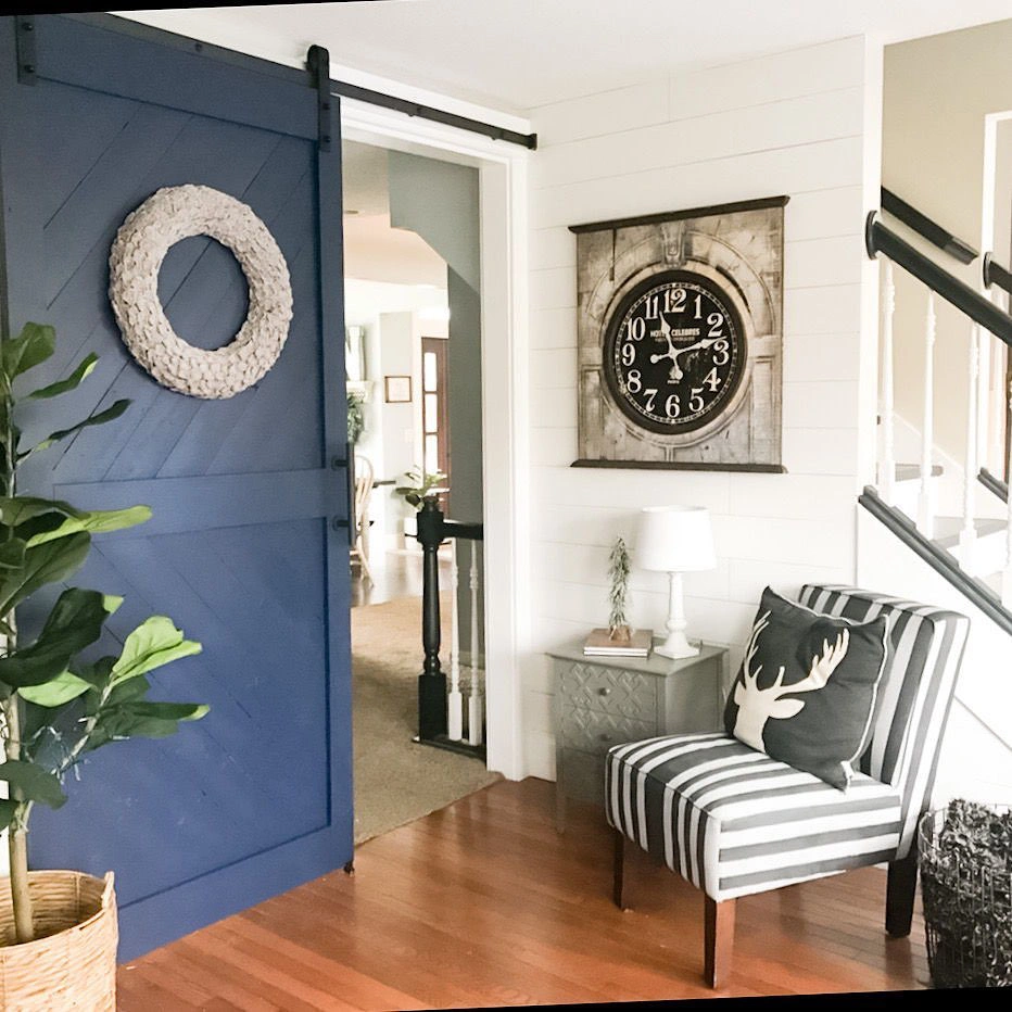Painted blue sliding barn door with Sherwin Williams Naval