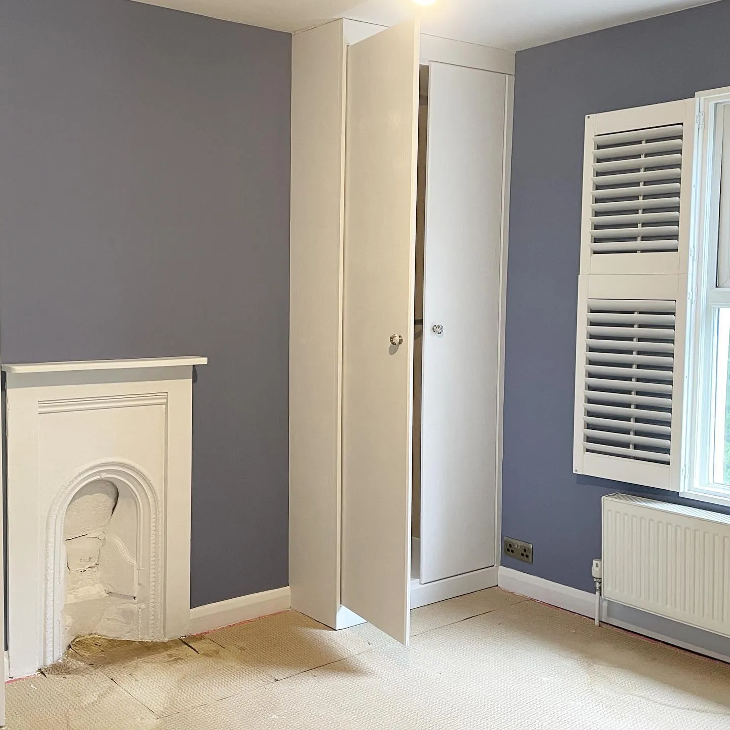 White cabinets and pale blue walls Little Greene Pale lupin