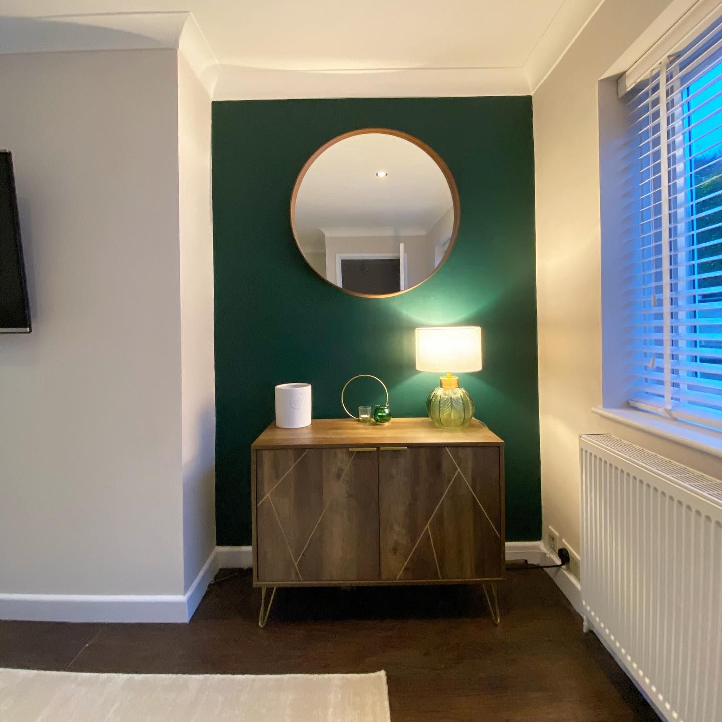 Green accent wall in living room Dulux Pine Needle