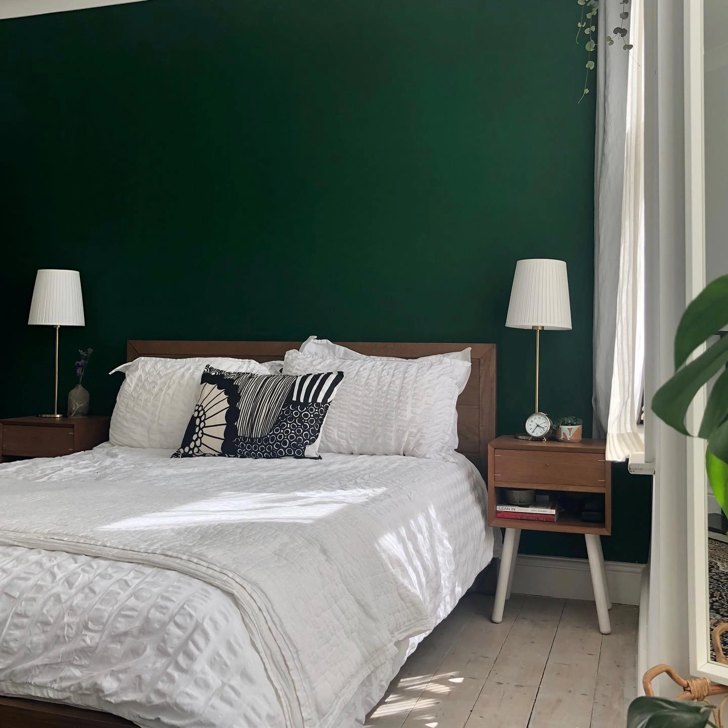 Dark green accent wall in a bedroom Little Greene Puck